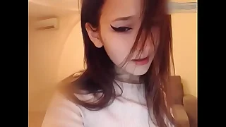 Magnificent korean girl uses a vibrator down masturbate